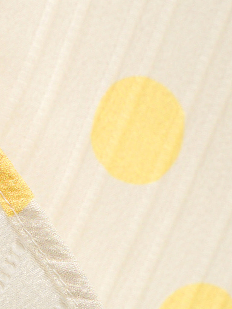 Robe beige à pois et boutons à revers des années 1950