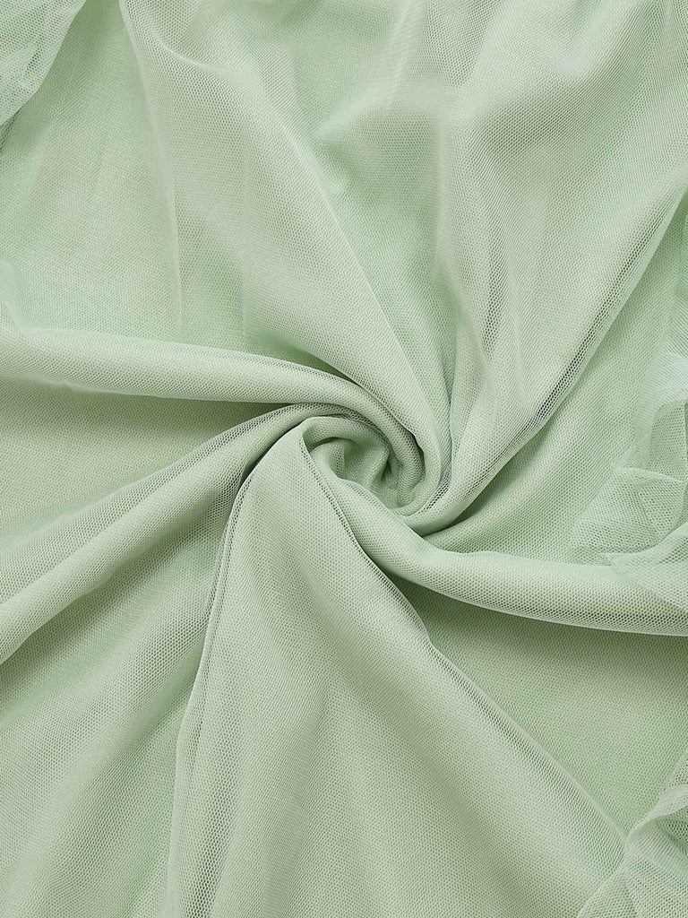 Robe verte en maille unie à volants manches illusion des années 1930