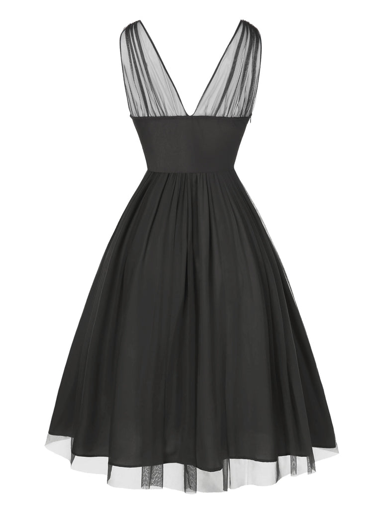 Robe trapèze noire fleurie en dentelle et maille années 1950