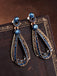 Boucles d'oreilles pendantes creuses en strass bleu