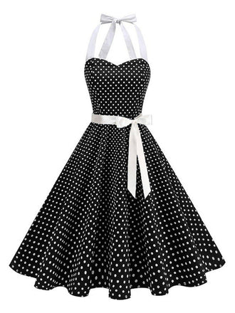 Robe swing ceinturée col halter à pois années 50