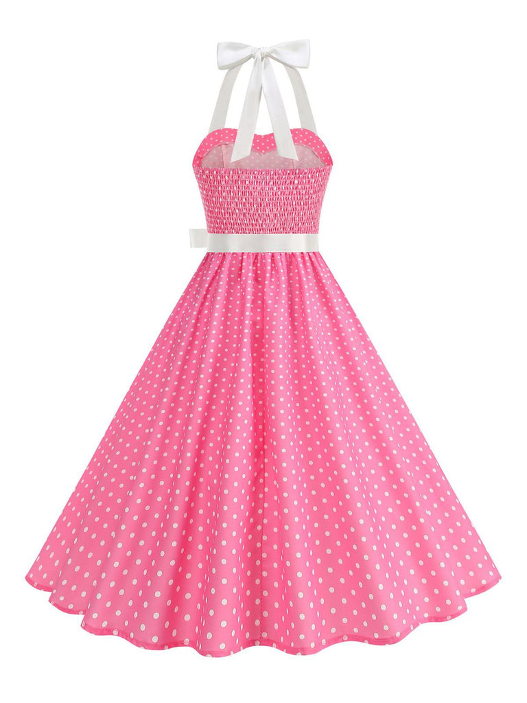 Robe swing ceinturée col halter à pois années 50