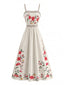 Robe florale fines bretelles et smocks années 1950