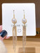 Boucles d'oreilles à pampilles en perles dorées vintage