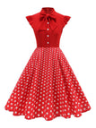 Robe trapèze à pois col nœud manches cape des années 1950