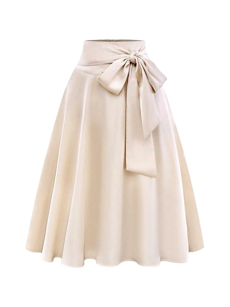 Jupe trapèze en satin beige avec nœud papillon des années 1970