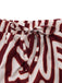 Red and white patterned shorts with a tie waist on a white background