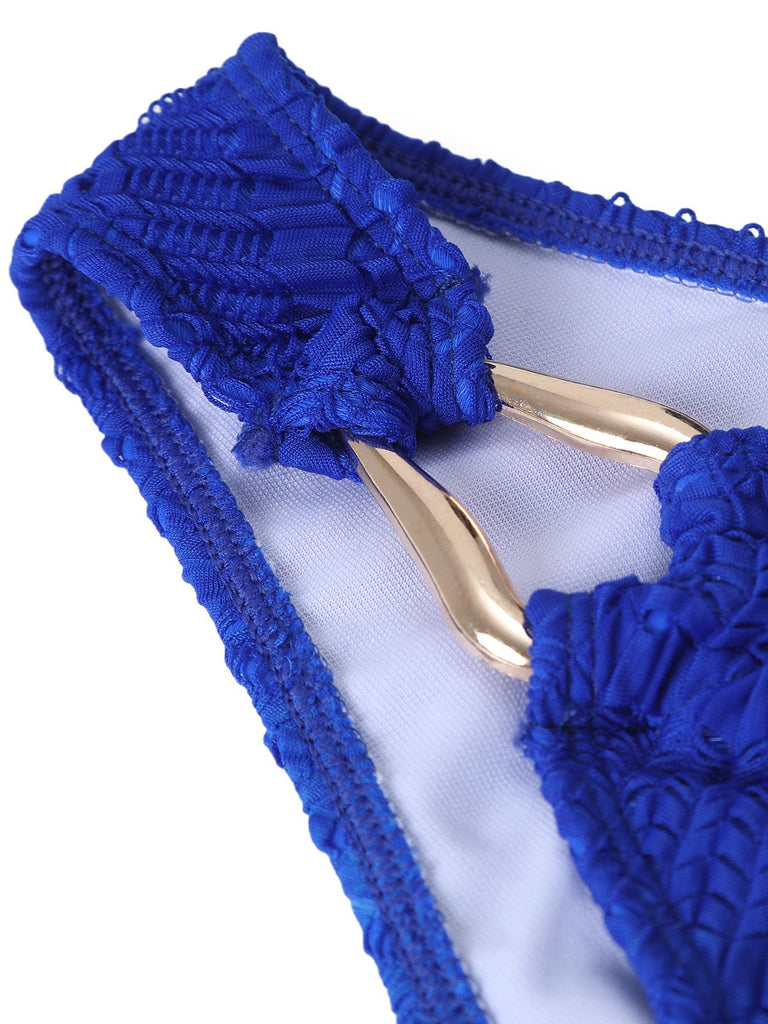 Blue lace headband with gold accents on a white background