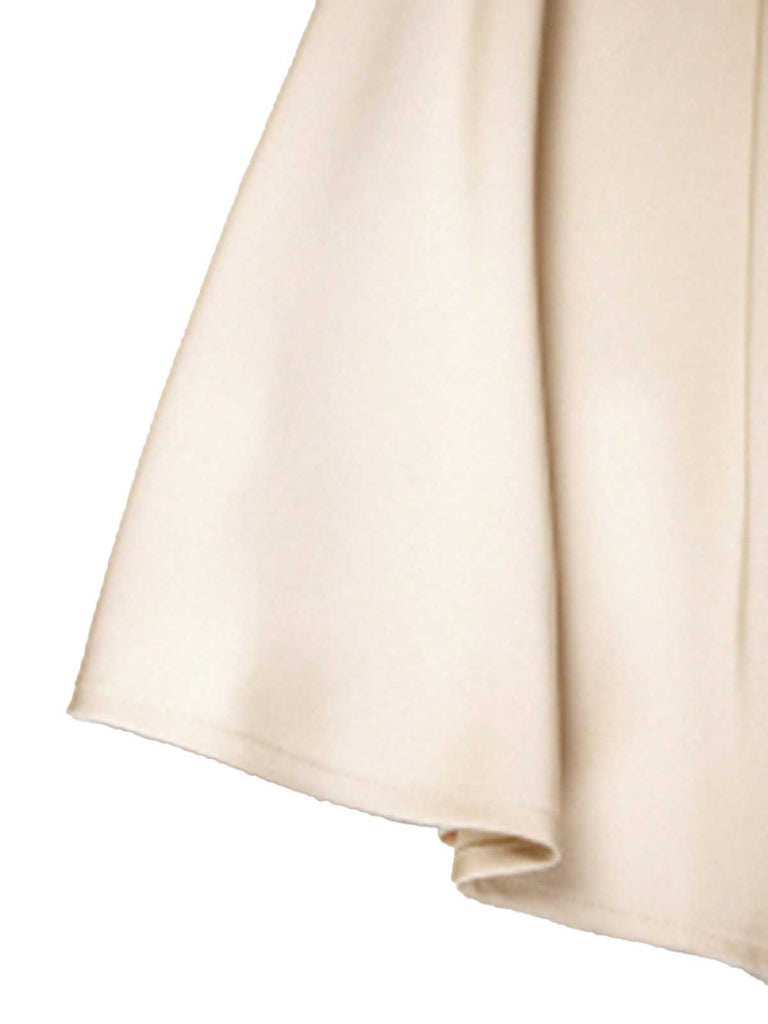 Jupe trapèze en satin beige avec nœud papillon des années 1970