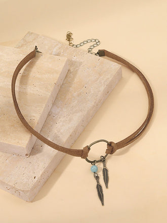 Boucles d'oreilles et collier ras du cou attrape-rêves et plumes