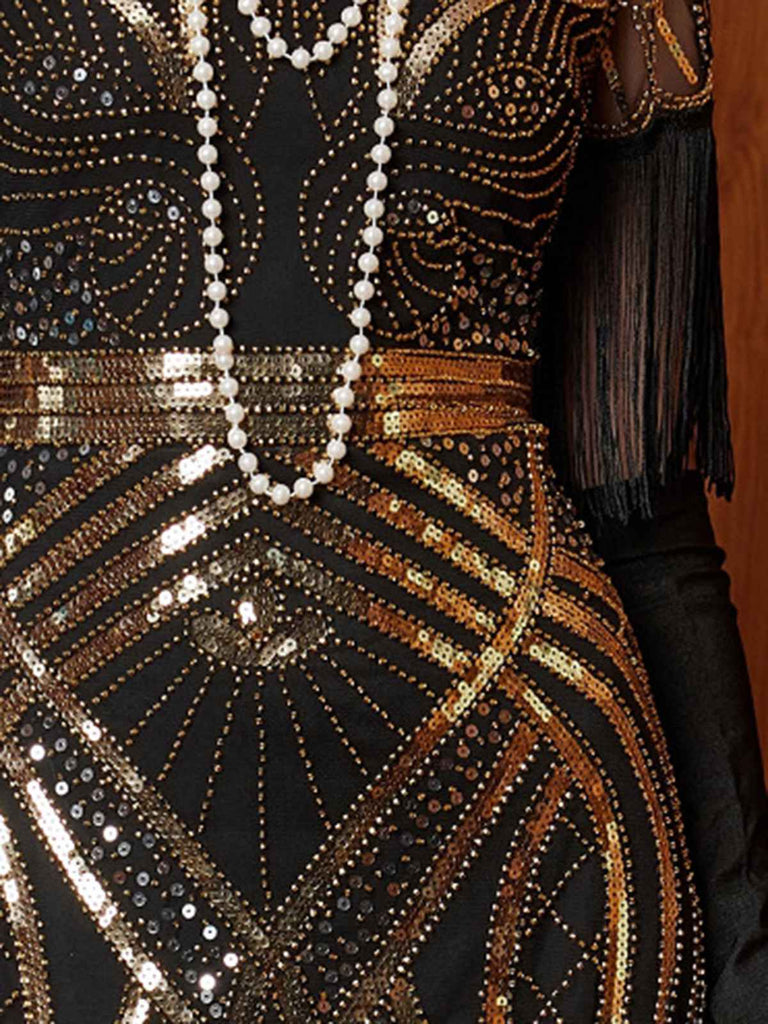 Robe longue à sequins dorés col en V et pompons années 1920