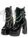 Bottes gothiques talons hauts vernis noir et ornées de chaînes