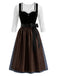 Ensemble noir avec robe à décolleté cœur et bordure contrastée, tablier et top blanc Années 1950