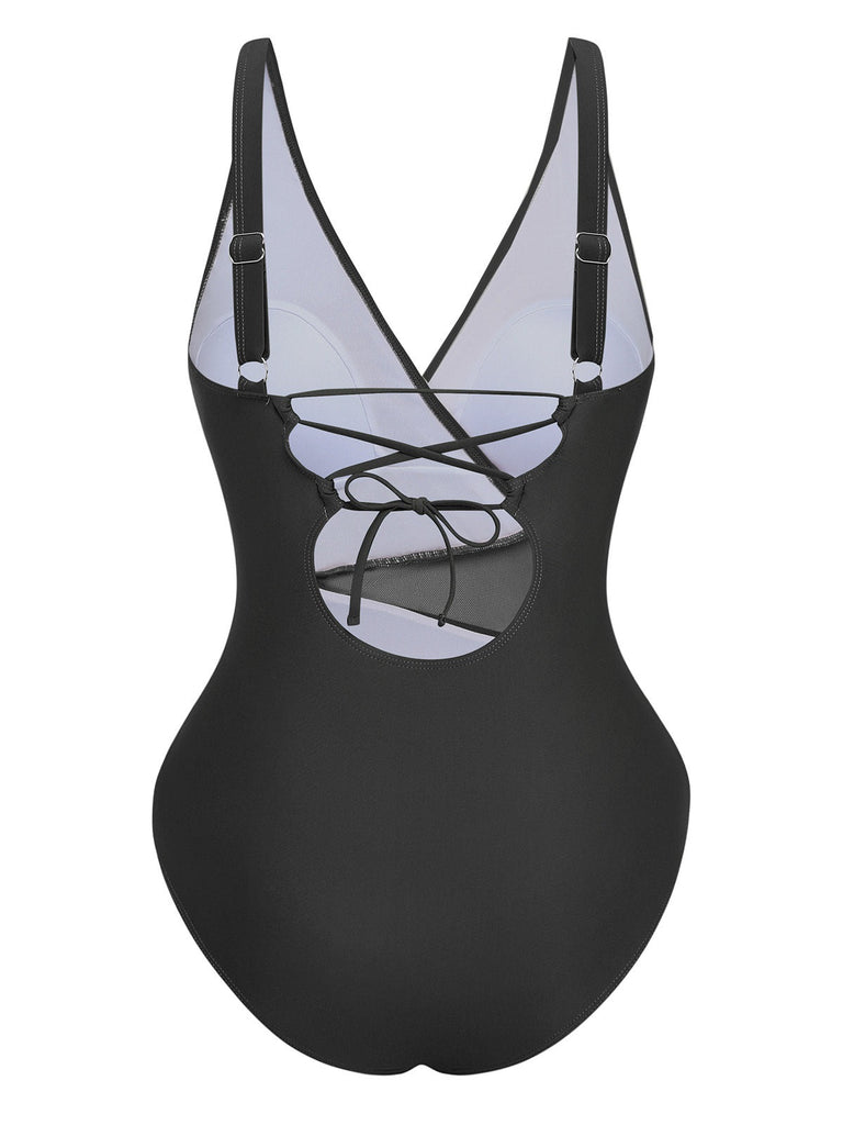 Black swimsuit with a unique design on a white background