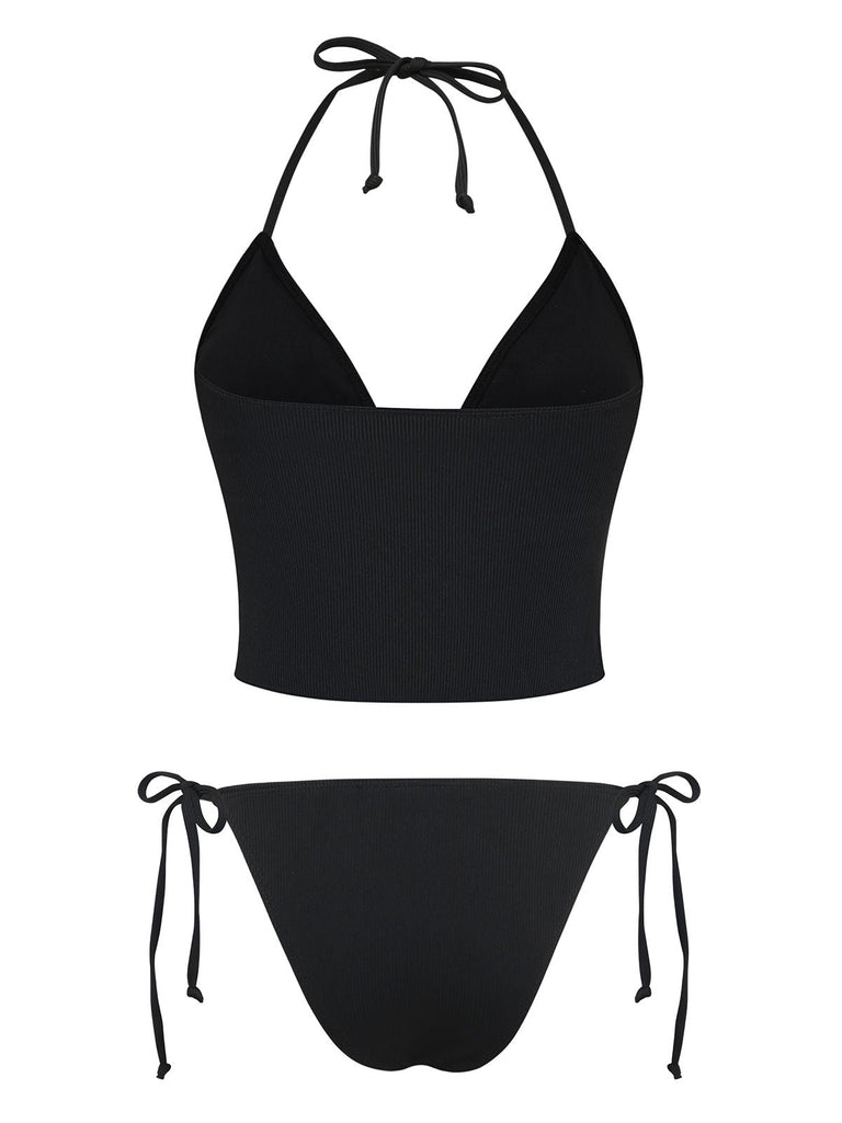 Black bikini top and bottom set on a white background