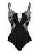 Black swimsuit with floral embellishments on a white background