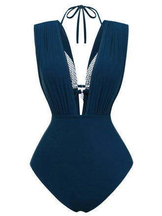 Maillot de bain bleu marine à col halter sur fond blanc
