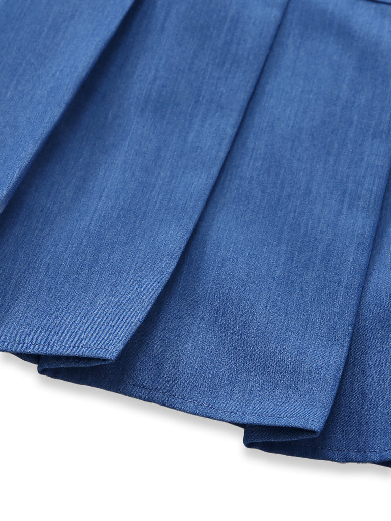 Close-up of blue fabric with pleated texture on a white background