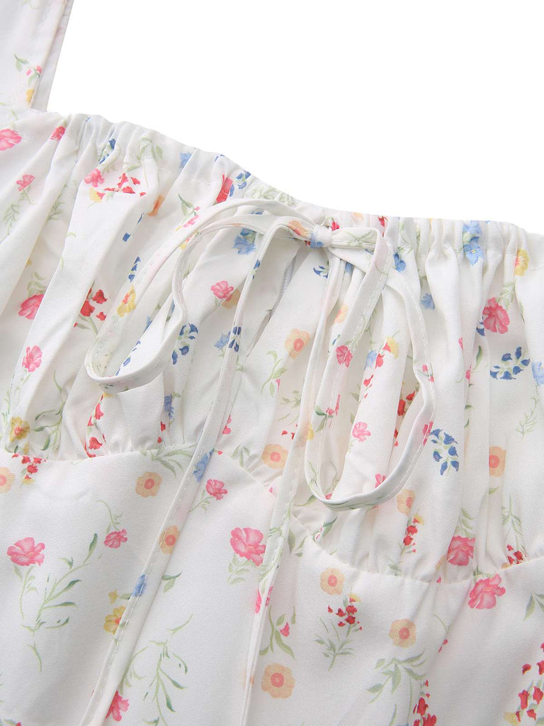 Robe blanche à fleurs col carré et manches bouffantes années 1930