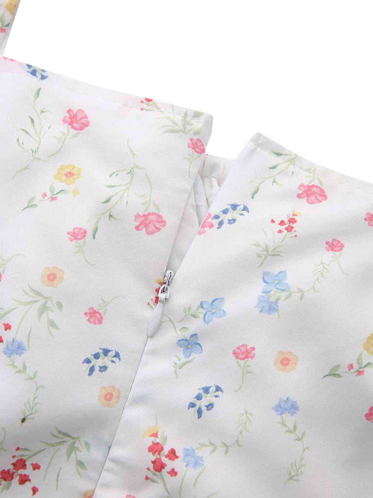 Robe blanche à fleurs col carré et manches bouffantes années 1930