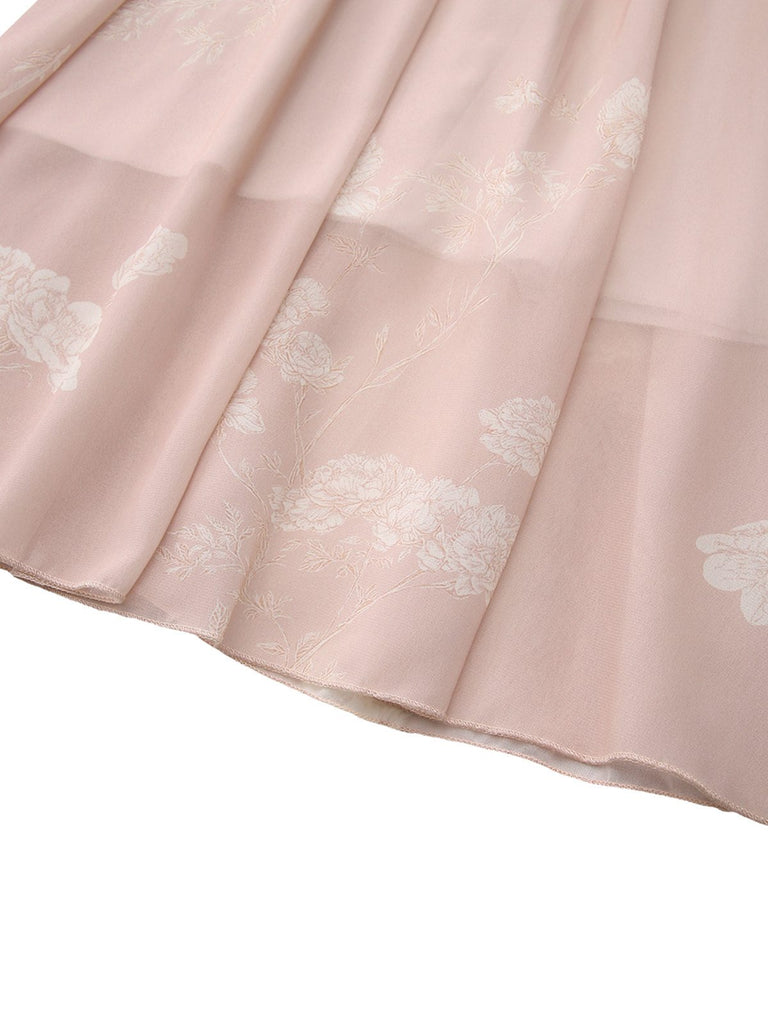 Robe rose sans manches à col V et ceinture florale années 1940