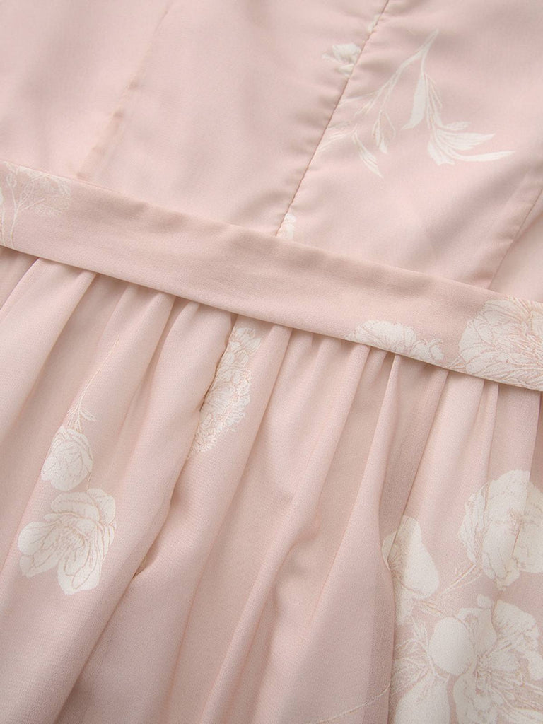 Robe rose sans manches à col V et ceinture florale années 1940
