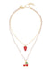 Necklace with cherry and strawberry pendants on a white background