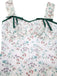 Floral dress with green straps on a white background