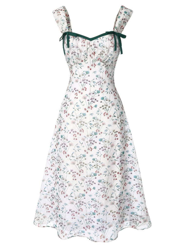 Floral dress with green straps on a white background