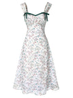 Floral dress with green straps on a white background