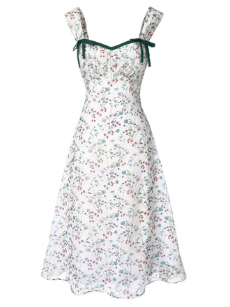 Floral dress with green straps on a white background