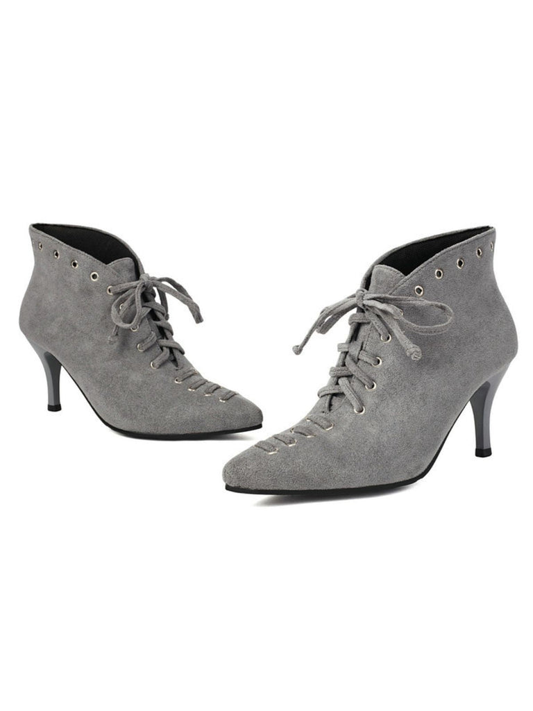 Gray suede ankle boots with lace-up design on a white background