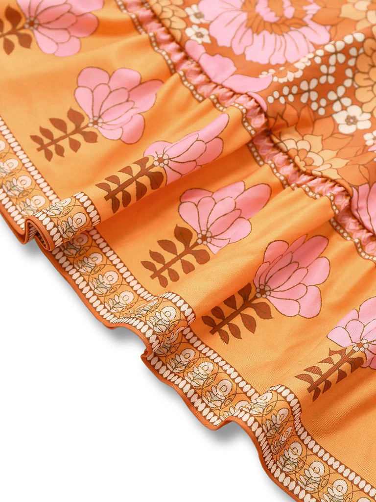 Robe fleurie orange hippie manches cloche des années 1960