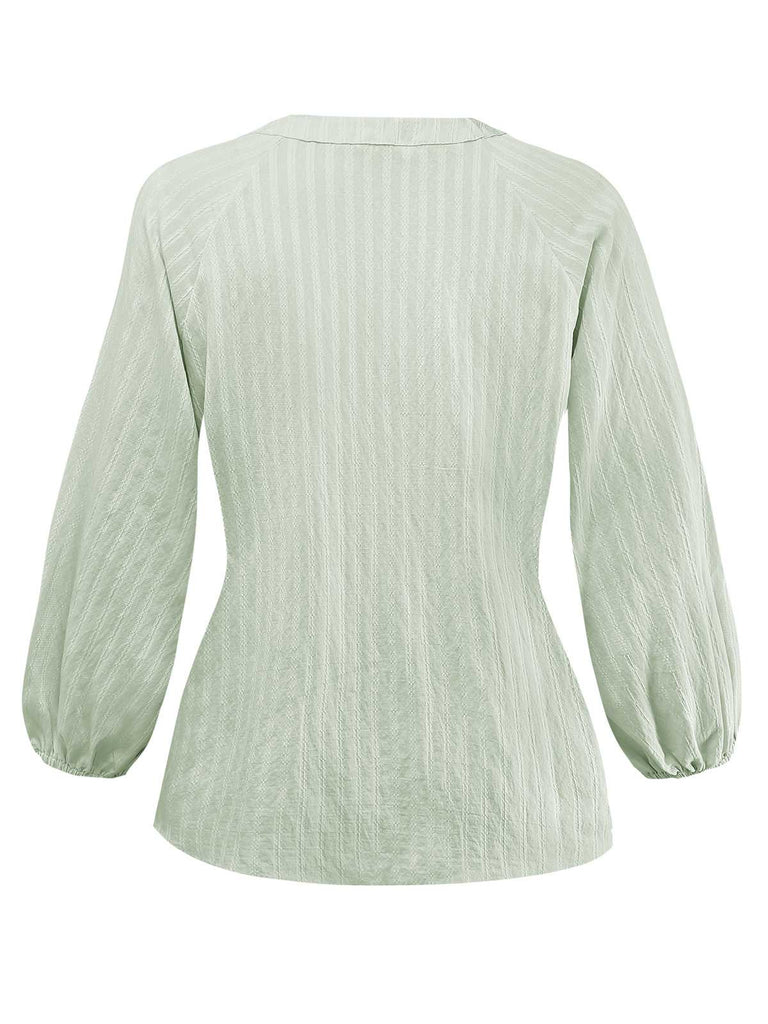 Chemisier vert col noué et manches bouffantes des années 80