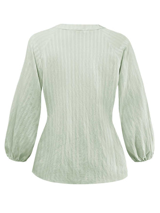 Chemisier vert col noué et manches bouffantes des années 80