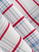 Close-up of fabric with red, gray, and blue plaid pattern