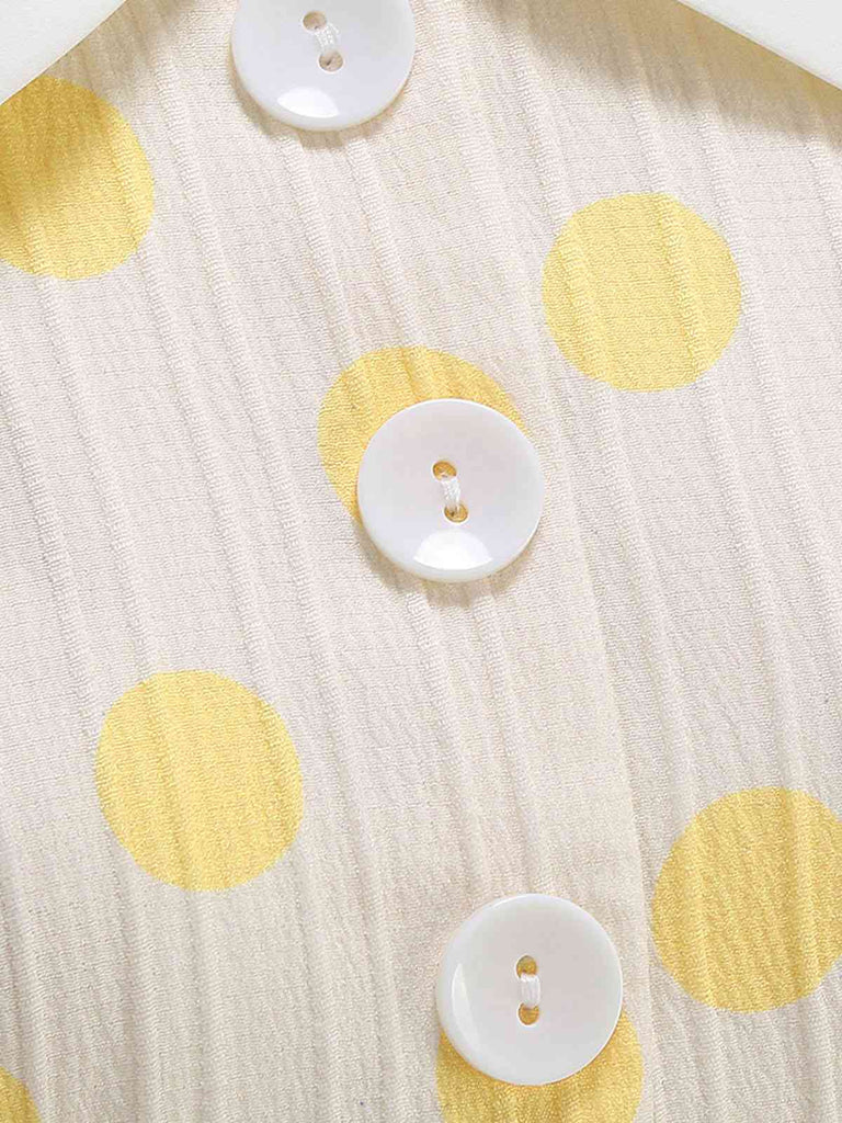 Robe beige à pois et boutons à revers des années 1950