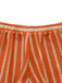 Close-up of orange and beige striped fabric with a frayed edge.