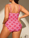 Person wearing a pink and white patterned swimsuit against a neutral background