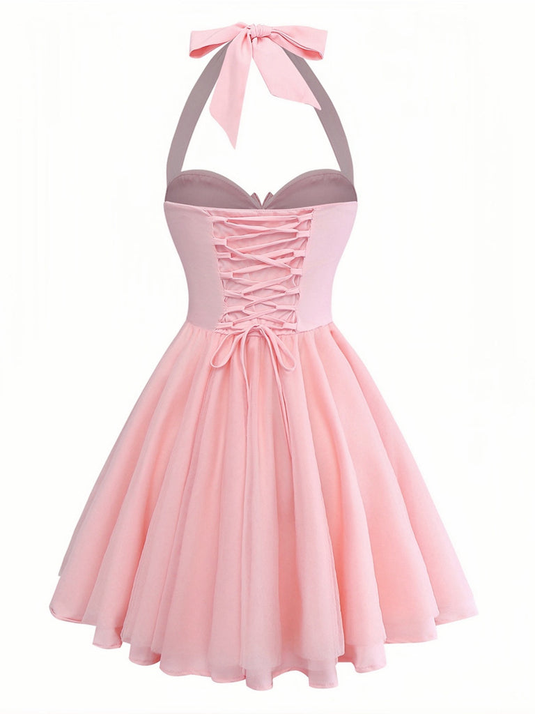 Pink dress with a bow detail on a white background