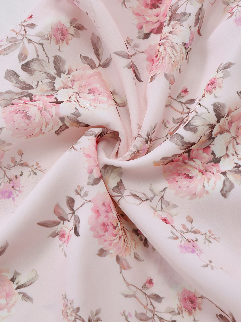 Floral fabric with pink flowers and green leaves on a light background