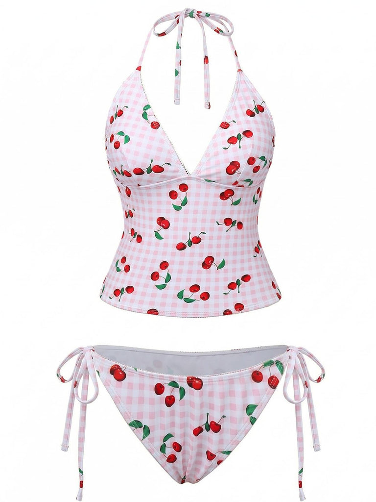 Two-piece swimsuit with cherry pattern on a white background