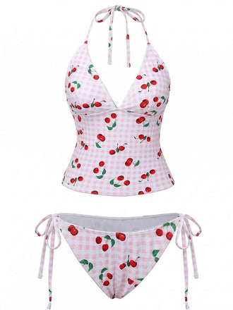 Two-piece swimsuit with cherry pattern on a white background