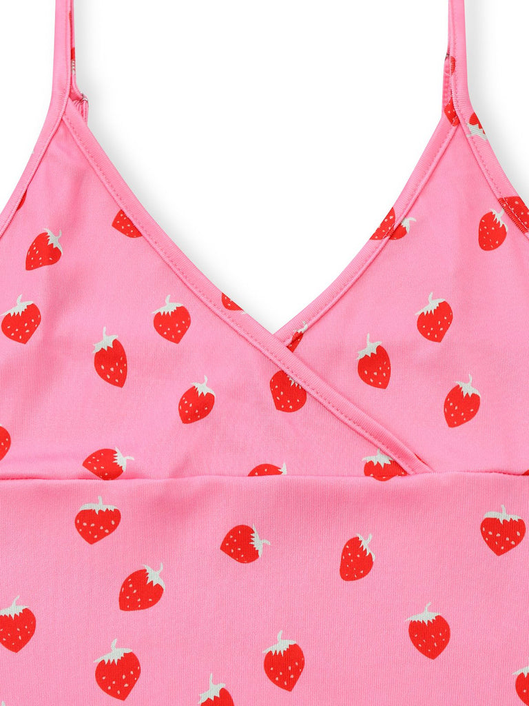 Pink top with red strawberry pattern on a white background