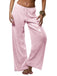 Pink sequin pants worn by a person on a white background
