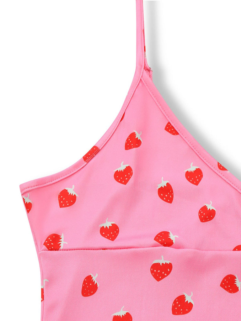 Pink top with red strawberry pattern on a white background