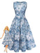 Robe bleue à fleurs portée par une poupée Barbie sur fond blanc