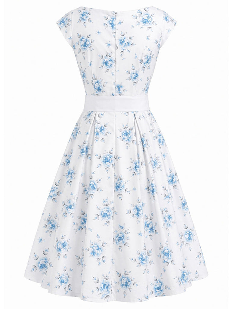 Robe jaune à fleurs col bateau ceinturée années 1950