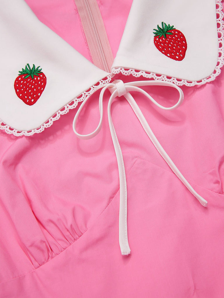 [Prévente] Robe rose en coton brodée fraises manches bouffantes dannées 1950