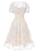 Robe blanche à fleurs brodées col V profond années 1950